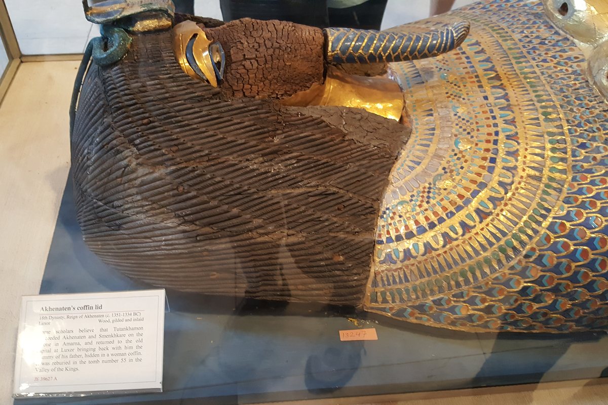 Ancient Egyptian museum object displayed beside its gallery label in Cairo